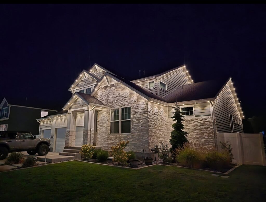 Permanent lighting tracing the gables of a home at night by Shark Illumination